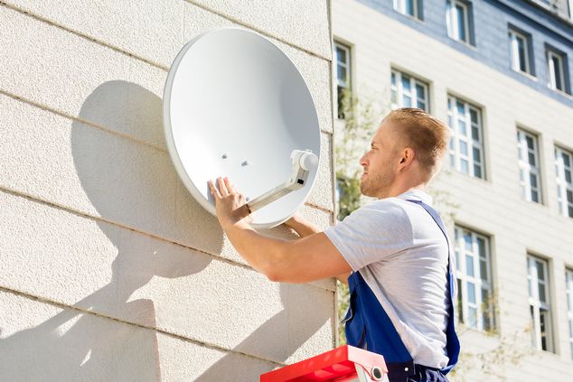 Man fitting an satellite dish